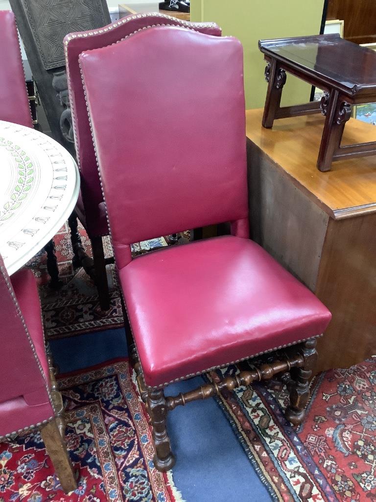 A set of six early 20th century Jacobean style oak high back dining chairs